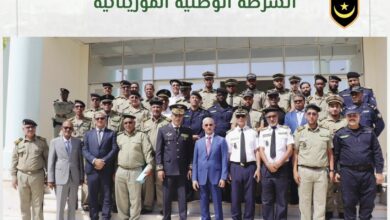 صورة تبادل المهام بين المدير العام للأمن الوطني الجديد و المدير العام للأمن الوطني السابق.